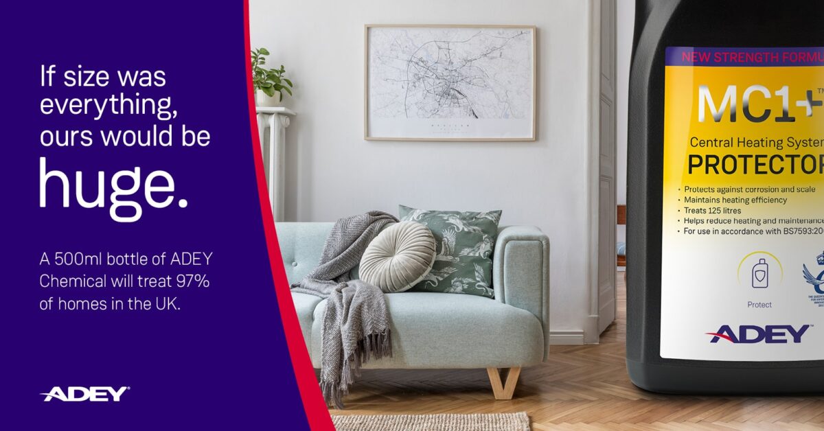 a couch in a room with a map on the wall, with ADEY chemical as a larger object in the room